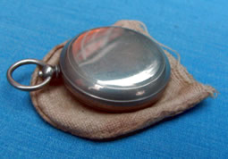 Small pocket compass in pouch