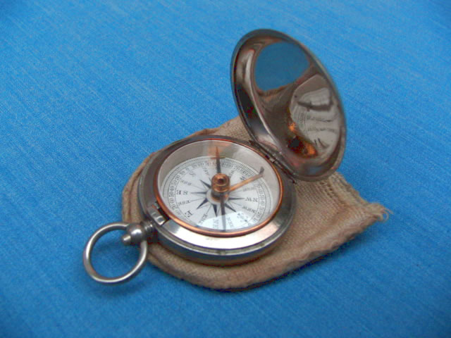 Small vintage pocket compass in cotton pouch