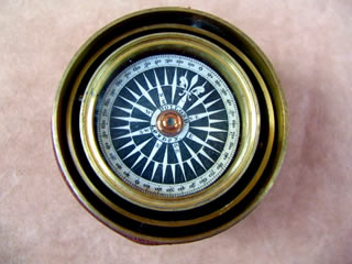 Close up view of compass card dial 