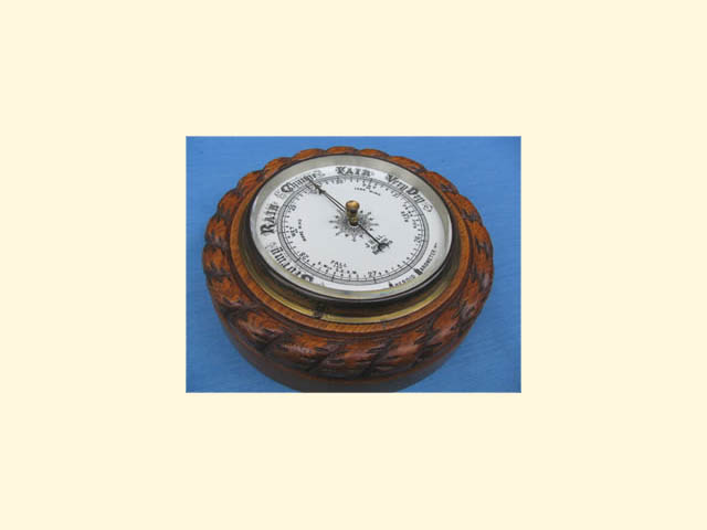 Oak aneroid barometer by J Hall Opticians, Bradford