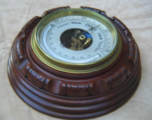 Mahogany mounted barometer with thermometer