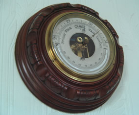 Mahogany mounted barometer with curved mercury thermometer