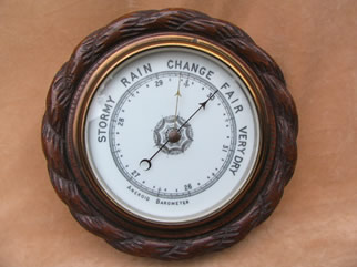Vintage oak mounted aneroid barometer