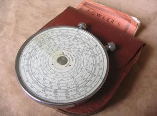 Fowler's Universal calculator with instruction book.