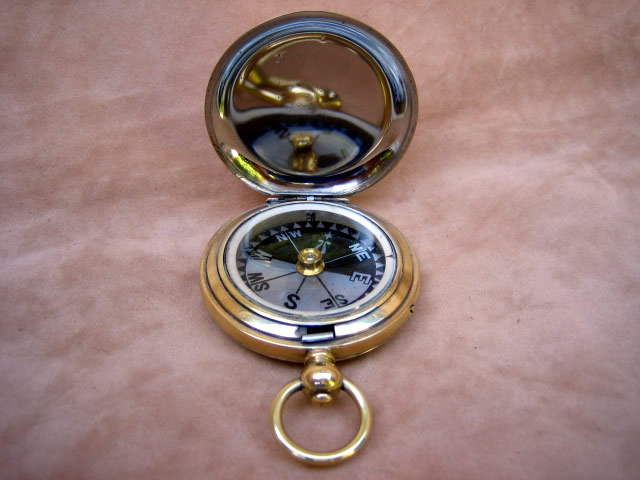 Late 19th C polished brass pocket compass with Mother of Pearl dial