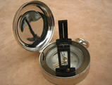 Vintage pocket compass with folding sight vanes