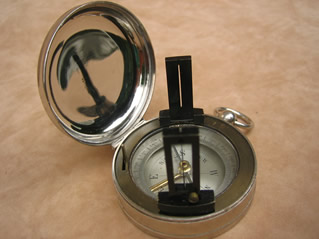 Vintage pocket compass with folding sight vanes