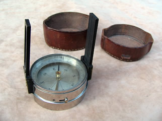 Leather cased pocket compass with folding sight vanes