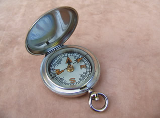 Military style pocket compass in a Dennison case