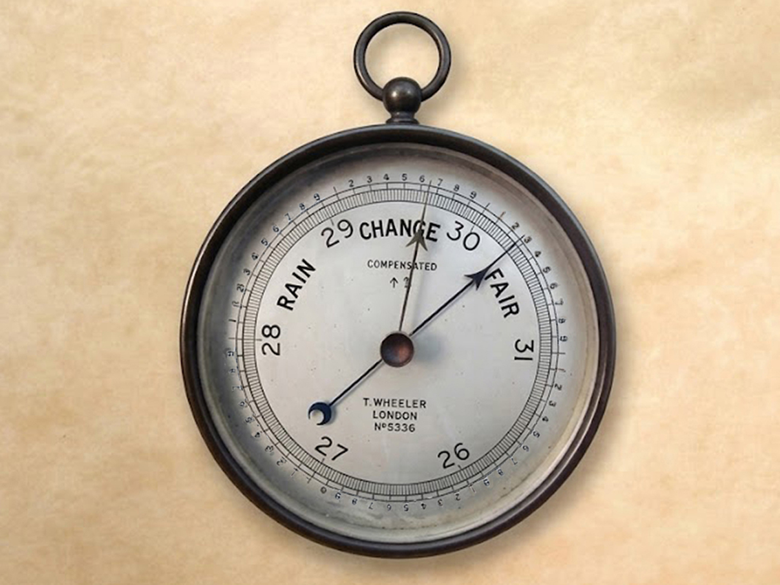 Brass cased aneroid naval barometer by T Wheeler