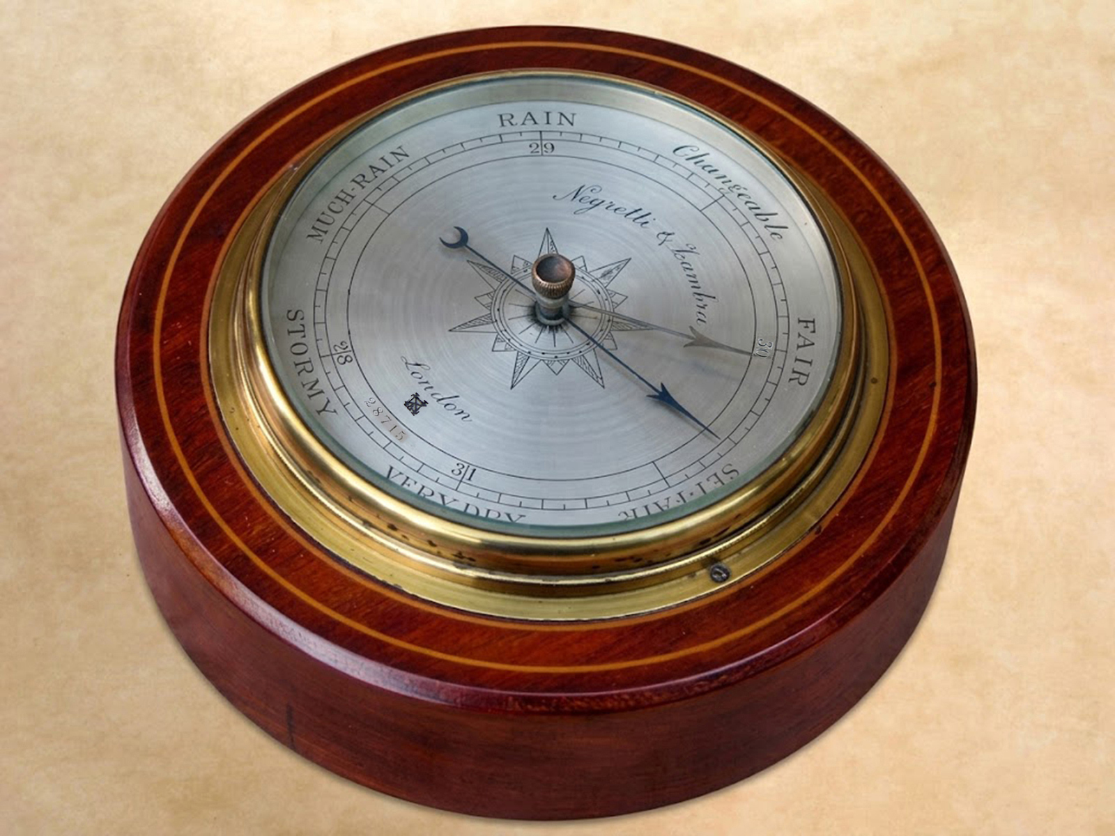 Circular wall barometer by Negretti & Zambra London