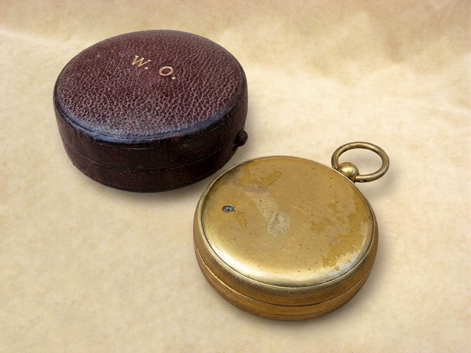 View of pocket barometer back showing gilding loss