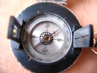 close up view of dial showing reversed East & West poles for direct reading
