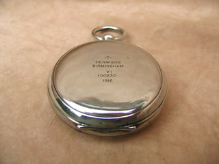 Top view of compass with lid closed, showing makers marks