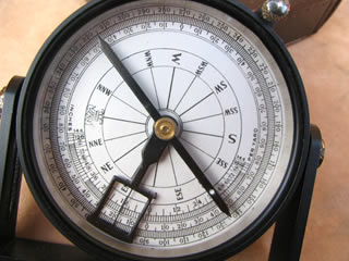 Close up view of compass dial & clinometer arm