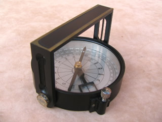 Handle compass with sight arm in upright position