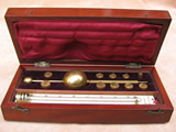 Antique sikes hydrometer set in mahogany case