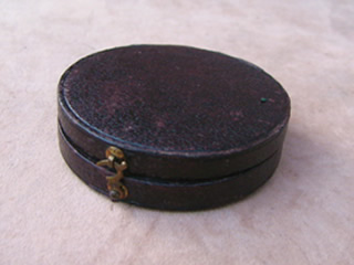Top view of Moroccan leather case with brass clasp