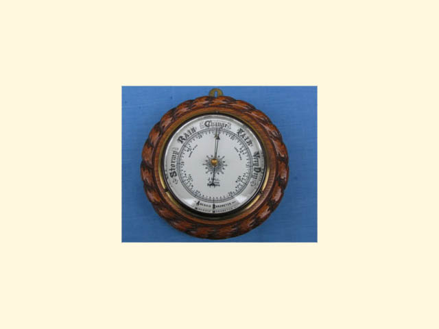 Oak aneroid barometer by J Hall Opticians, Bradford