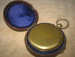 Early 19th century gilded brass pocket compass with porcelain dial