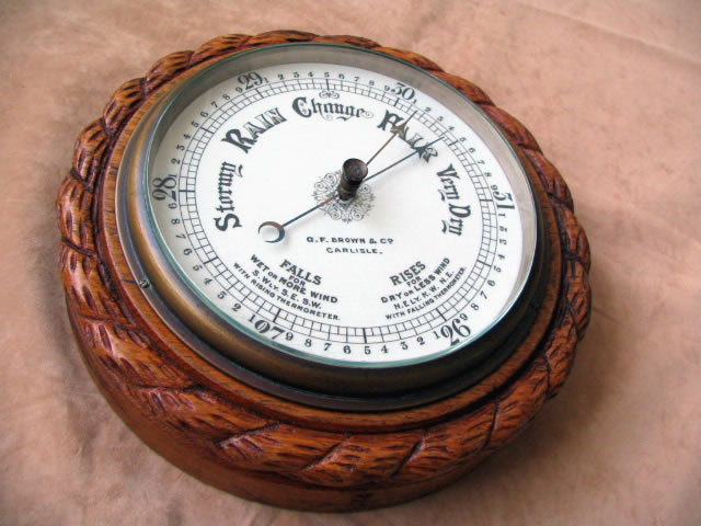 19th century rope twist aneroid barometer in Oak surround