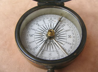 Close up view of dial with cross bar needle
